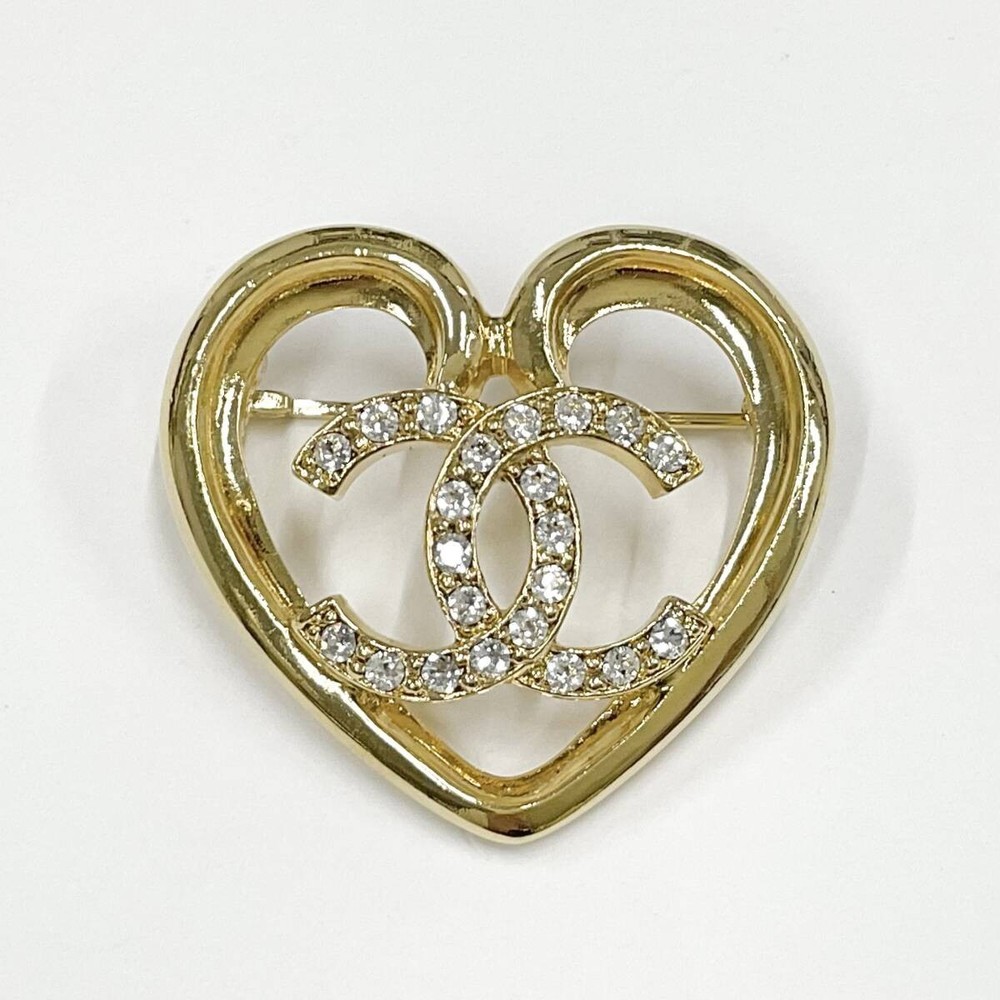 Chanel heart brooch with rhinestone details in gold tone