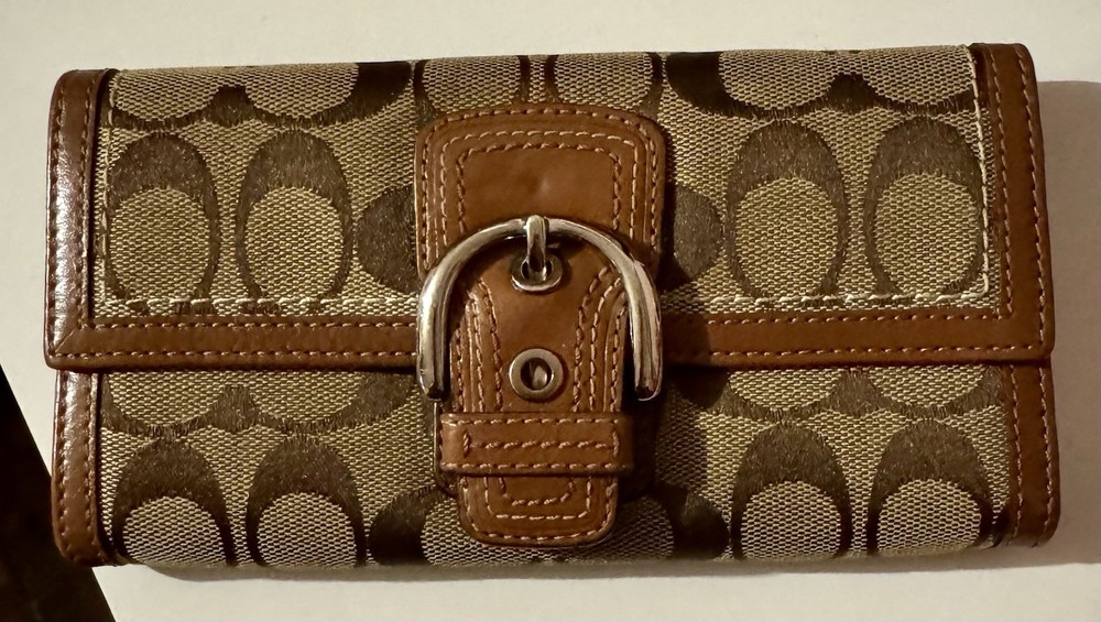 Coach Signature Soho Buckle Trifold Wallet.