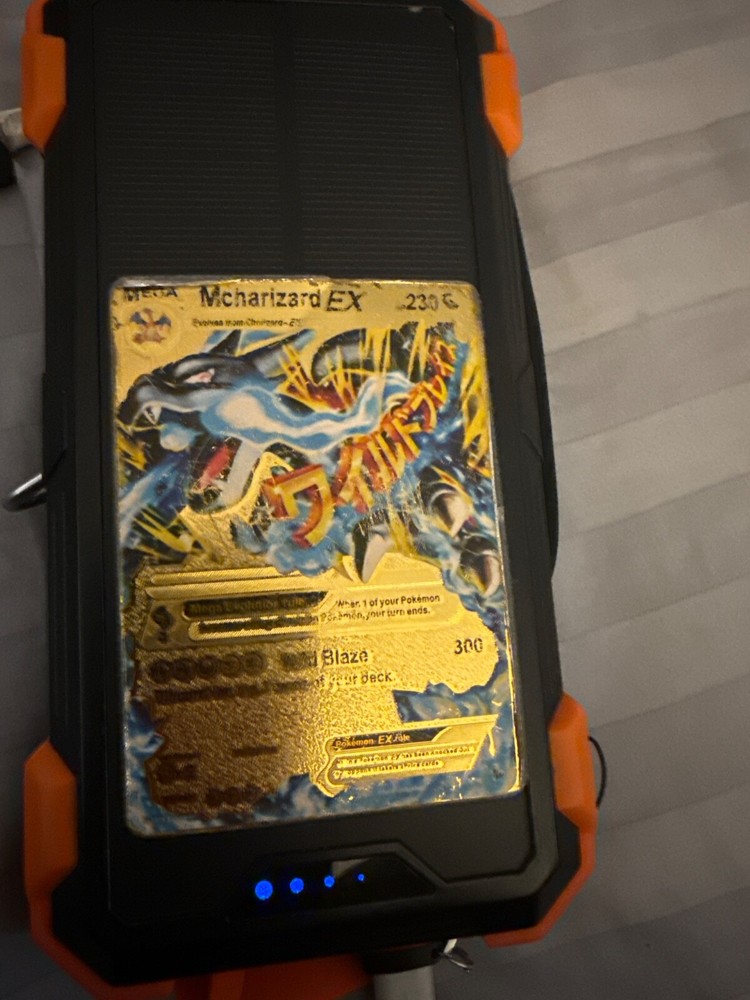 gold mcharzard pokemon in fair condition moderately played with