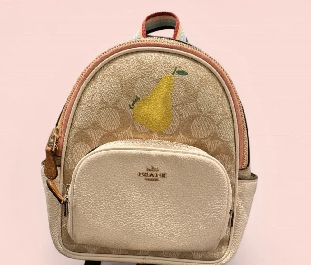 Pre-Owned Coach Mini Court Backpack in Signature Canvas with Pear Charm