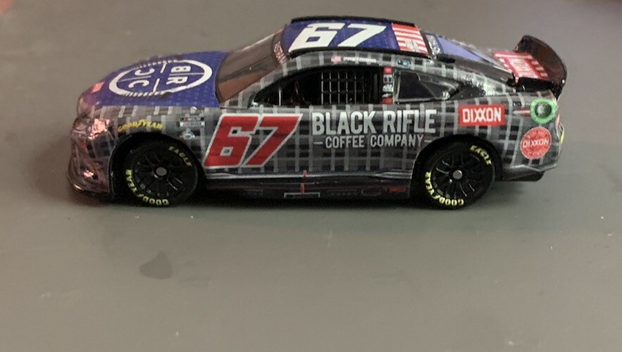 2023 Travis Pastrana #67 Black Rifle NASCAR 1/64 Diecast Preorder