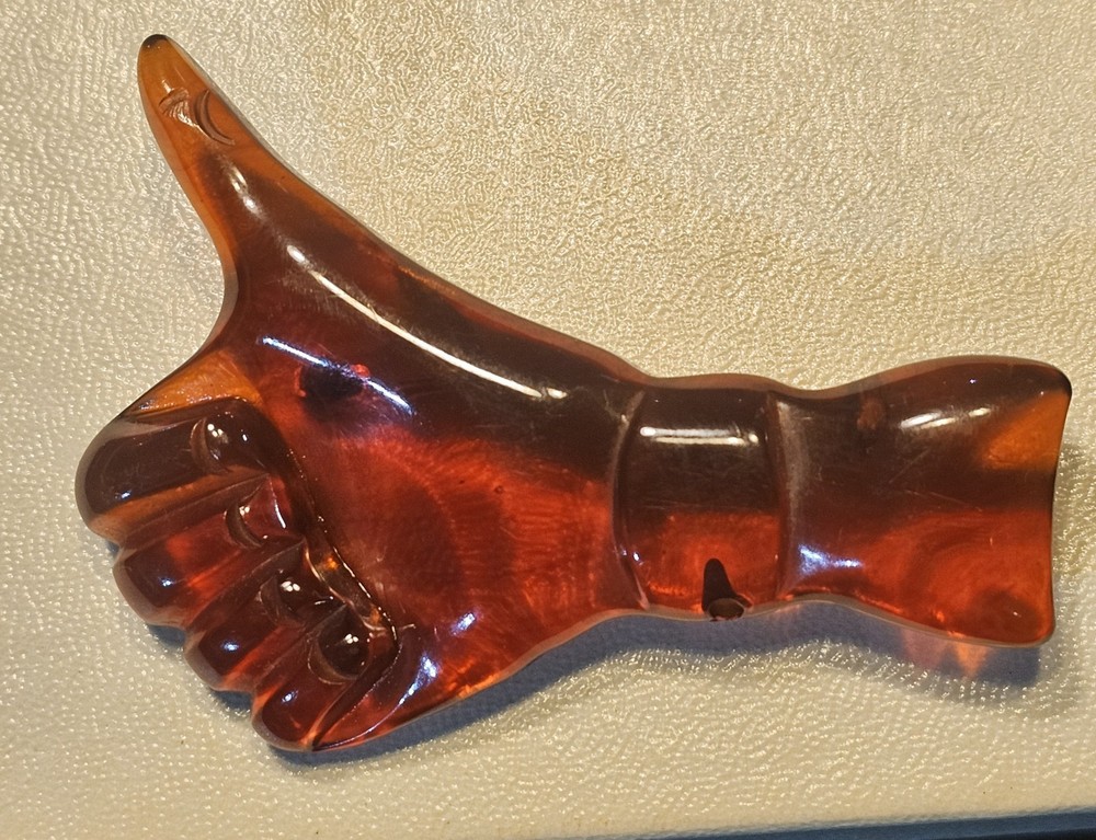 AMBER  BAKELITE THUMBS UP PIN  2 3/4