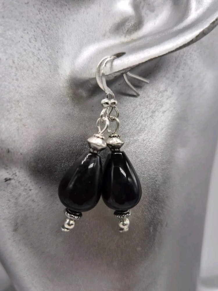 Gold tone black earrings with natural onyx teardrop beads