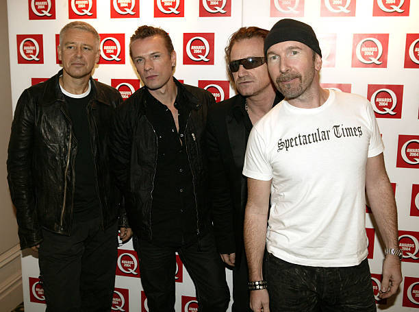 Members of U2 Adam Clayton Larry Mullen Bono and The Edge arrive - 2004 Photo 5-image