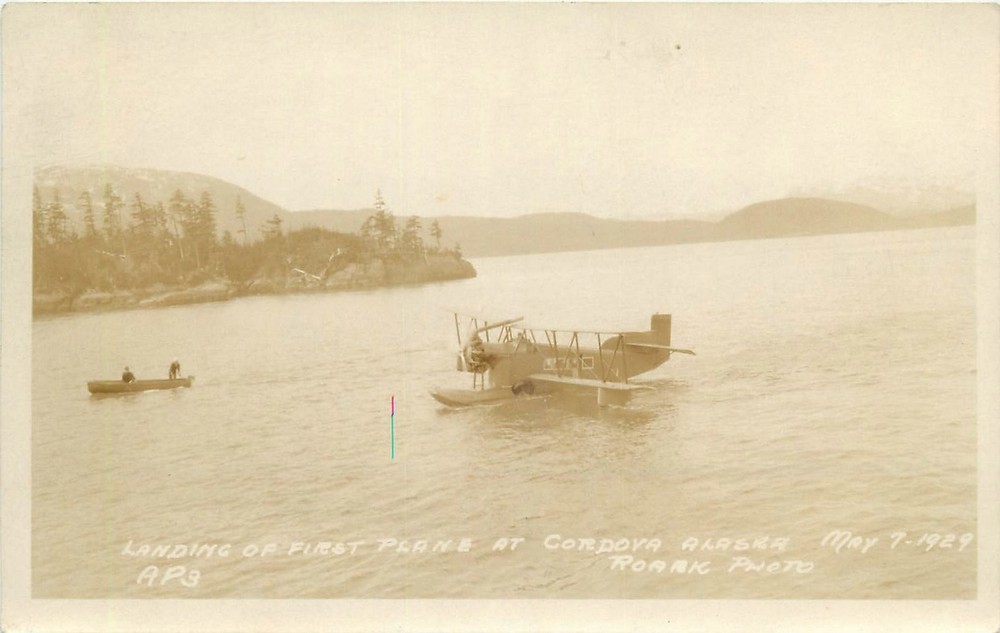 1939 Cordova Alaska Landing of 1st Plane Canoe Roark RPPC Postcard 25-6486
