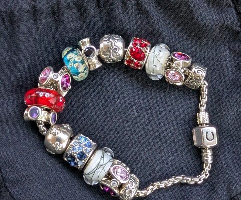 Chamilia Sterling Silver 925 7.5 Inch Bracelet. 13 Charms, 2 End Clasp Beads.