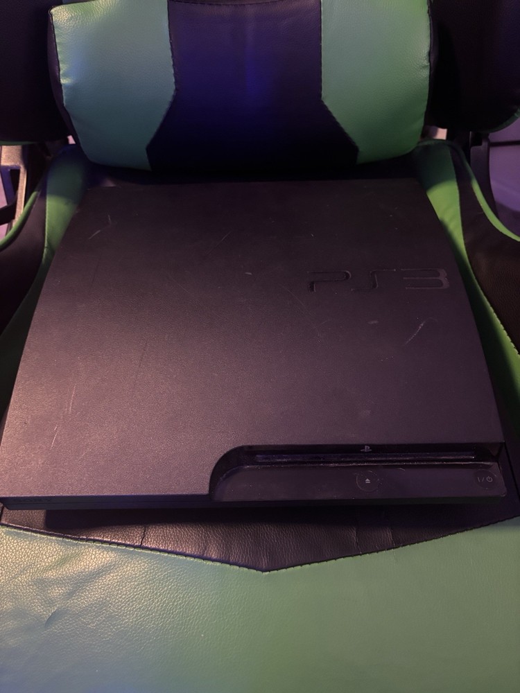 PlayStation 3 console with controller and games all functional and ready to play