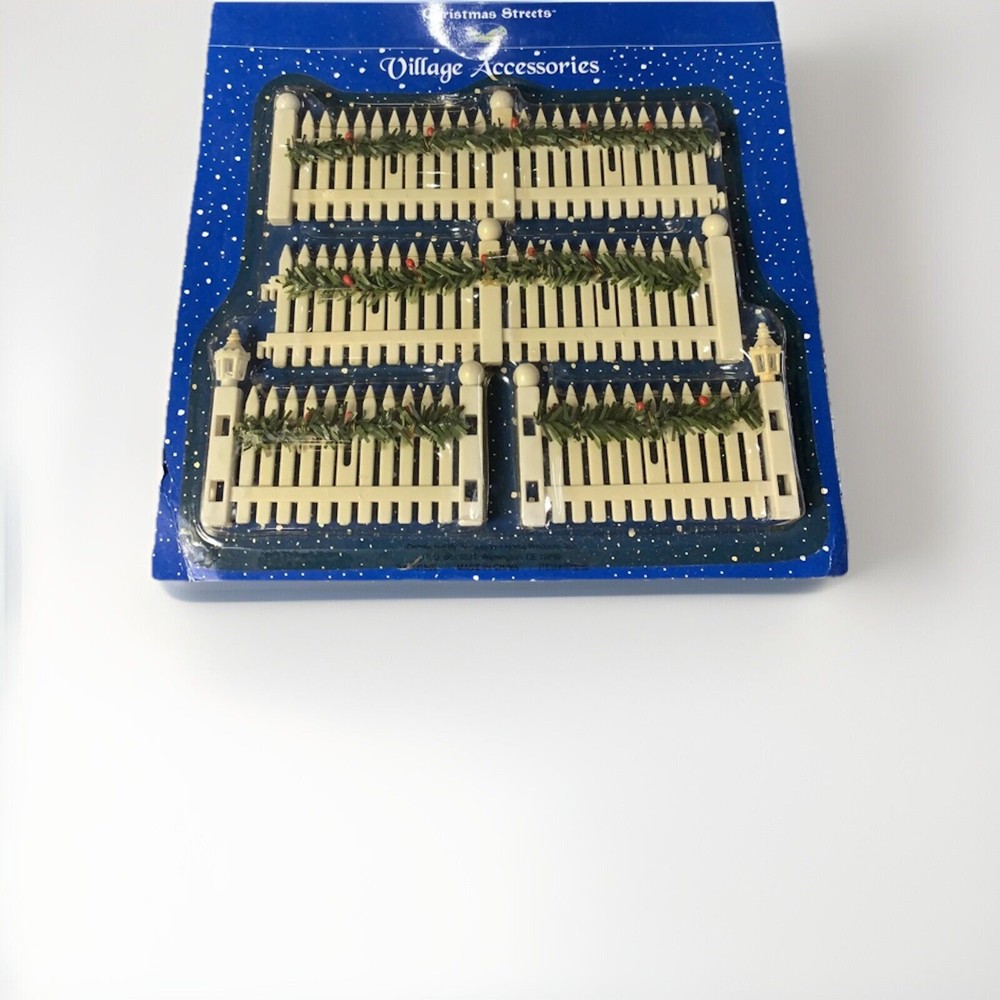 Festive White Picket Fence with Christmas Garland Decor