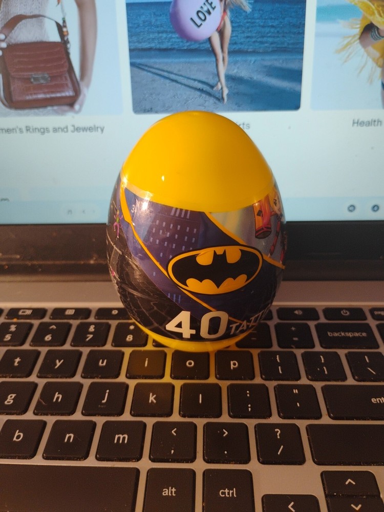 Yellow plastic Egg with 40 DC Batman temporary tattoos sealed