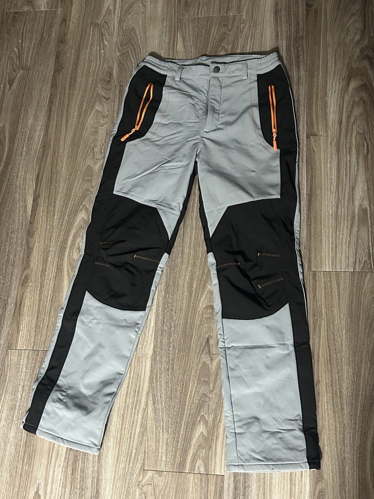 “Durable Two-Tone Work Pants with Reinforced Knees and Orange Accent Zippers”