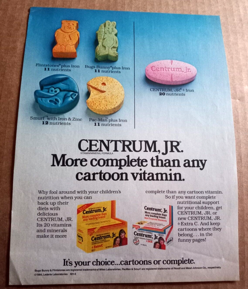 1985 Centrum Jr vitamins vs Pac-Man Flintstones Smurfs vintage ad page