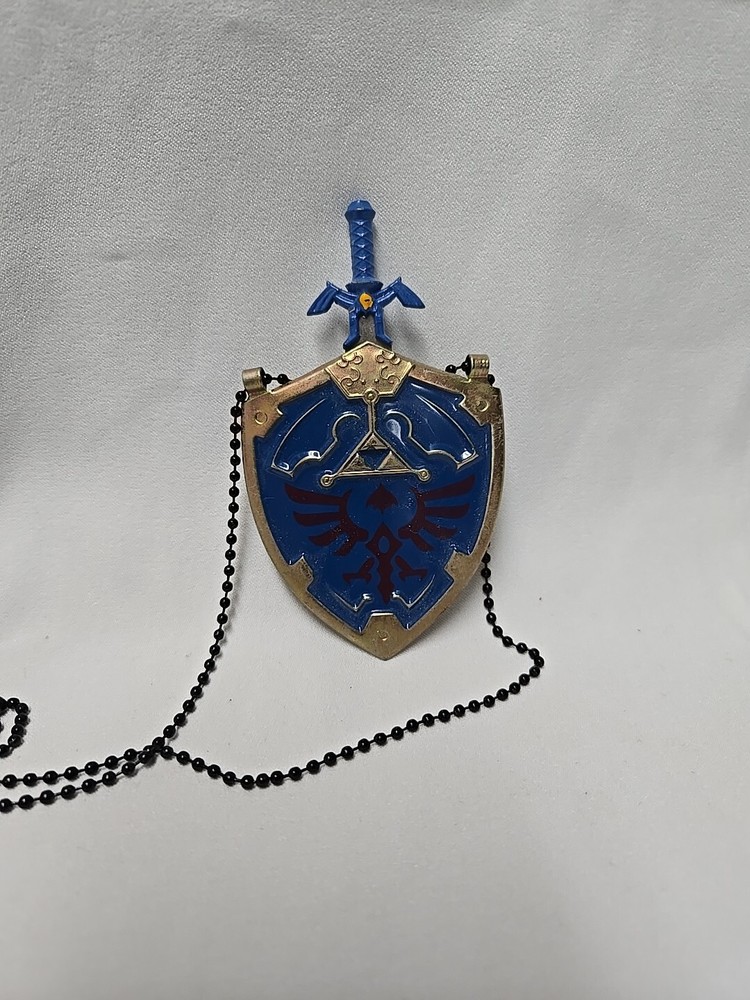 Legend of Zelda Hylian Metal Shield & Master Sword Necklace Gold Version
