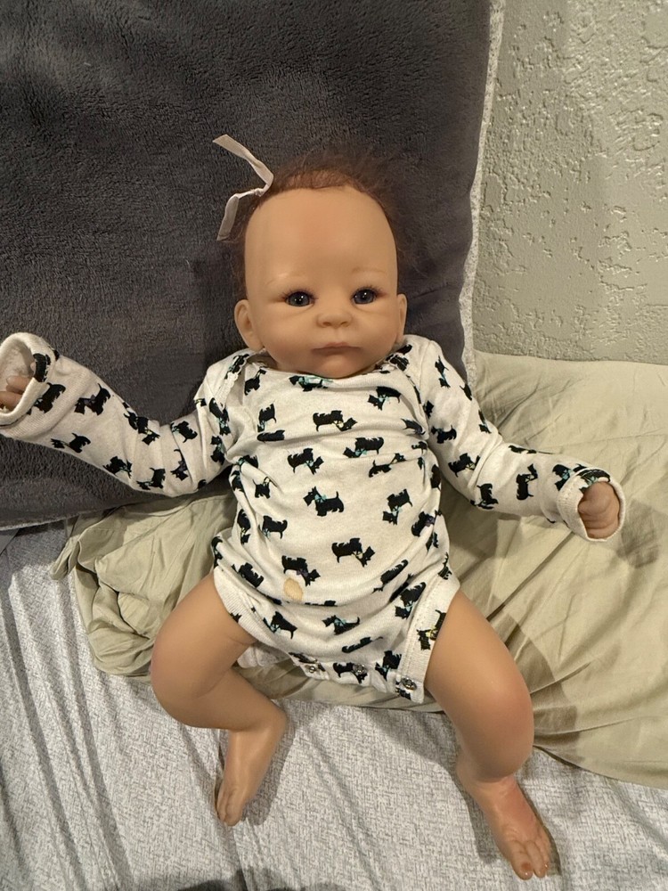 Realistic baby doll with blue eyes for girls