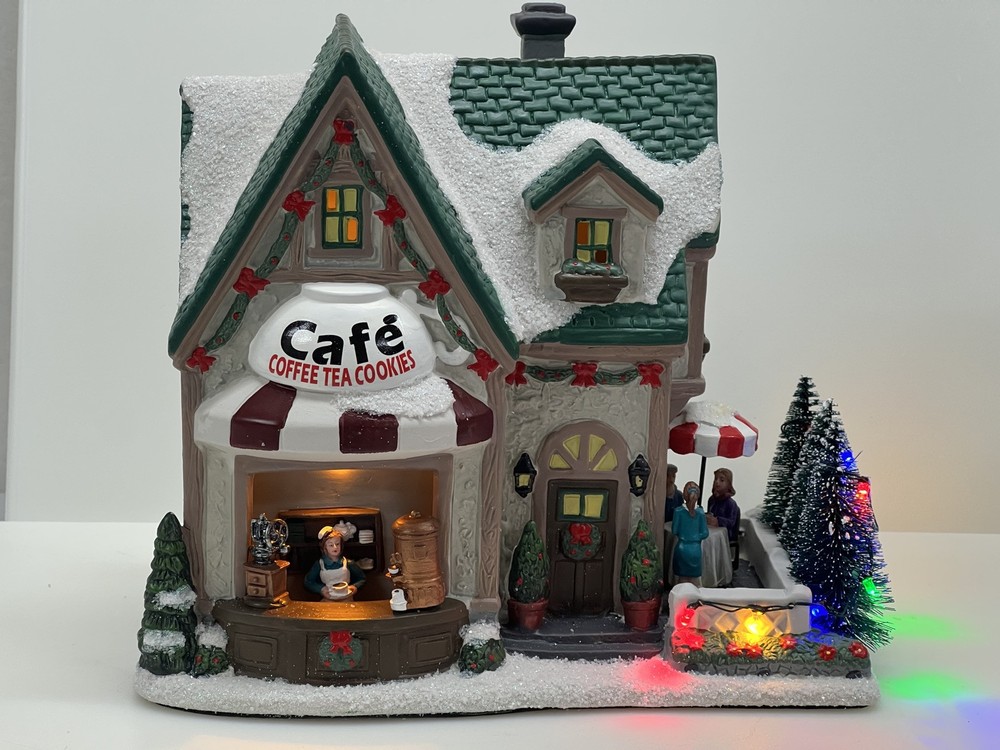 Discover the Enchanting St Nicholas Square Village Town CAFE in New Town