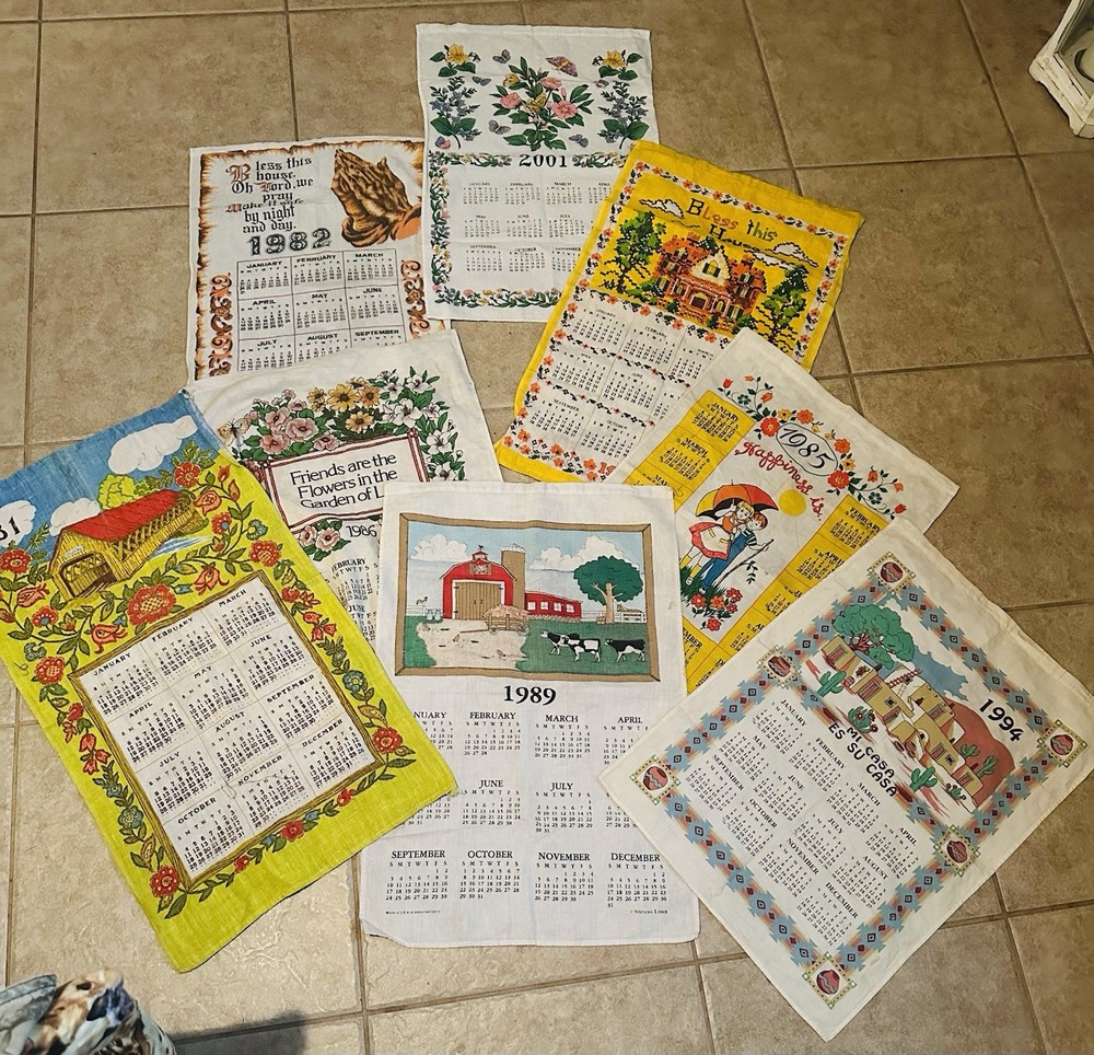Collection of vintage decorative calendar tea towels.