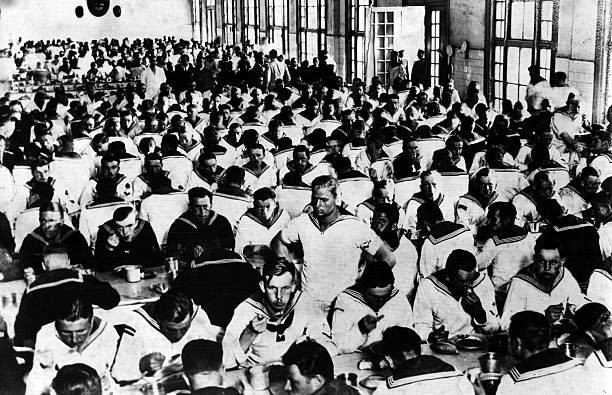 The crew of the German battleship Admiral Graf Spee eat a meal in - Old Photo