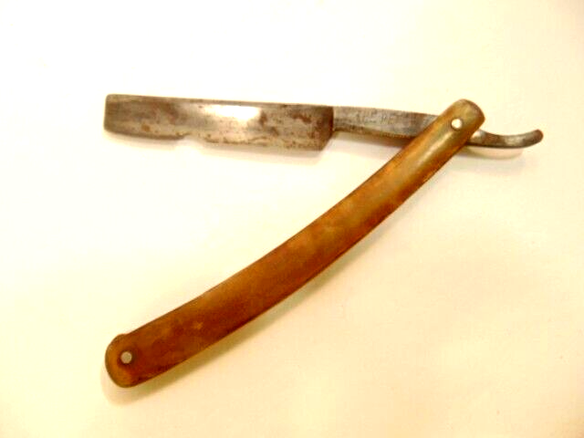older straight razor labeled 