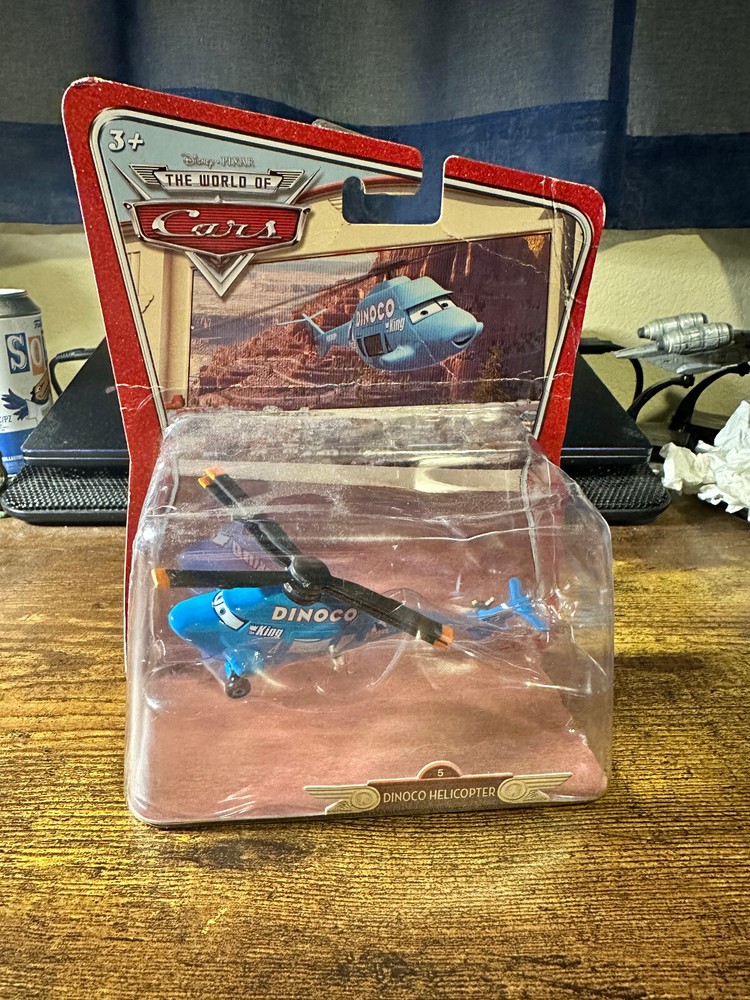 DISNEY PIXAR Cars THE WORLD OF CARS #27 Dinoco Helicopter King - NEW