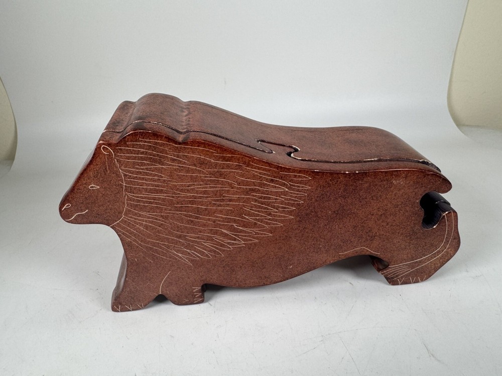 Hand-carved 6.5-inch Kenyan stone lion puzzle box with missing tail piece