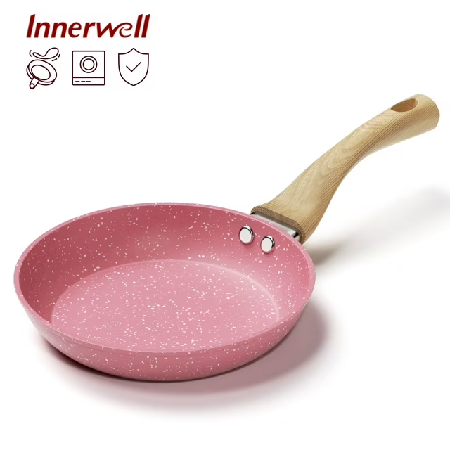 Pink nonstick frying pan with heat-resistant Bakelite handle