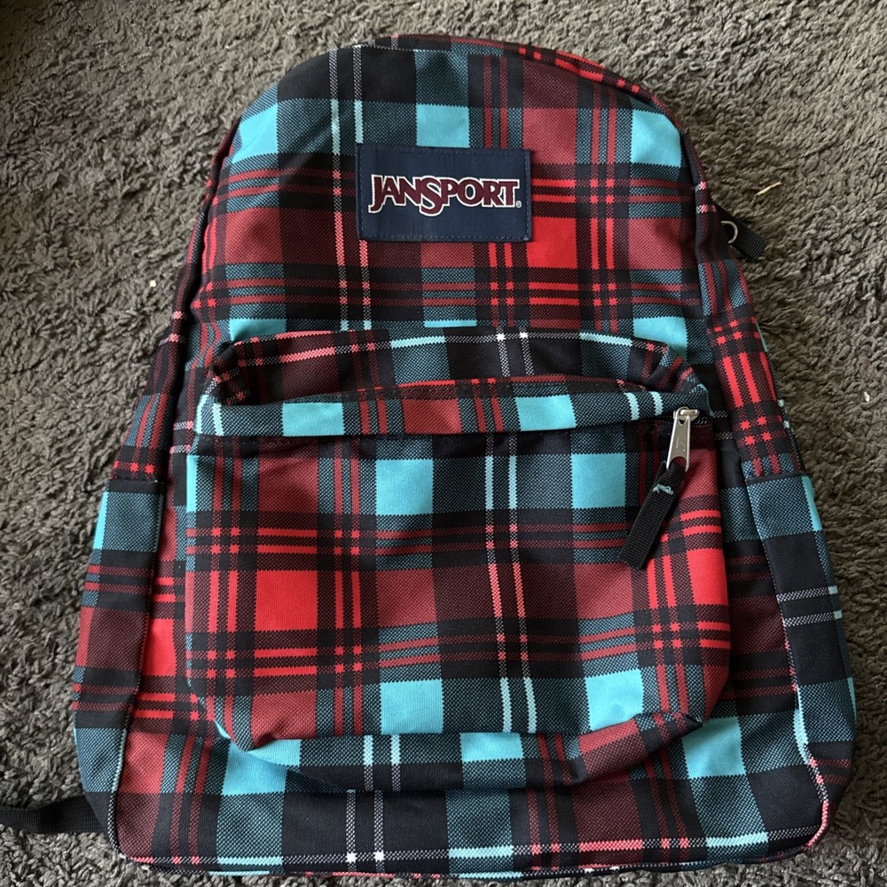 Multicolored Red,Teal, Black Jansport cloth backpack- front pocket