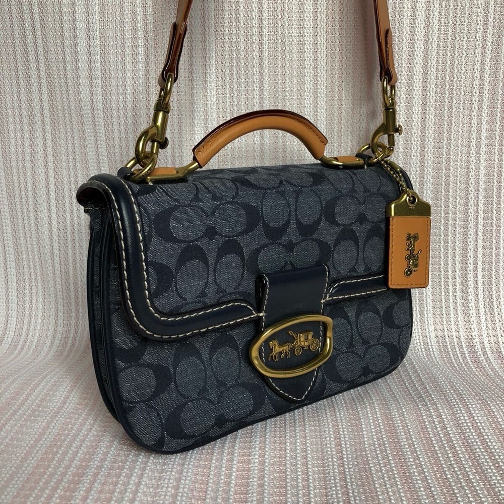 COACH navy handbag with adjustable shoulder strap