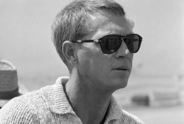Steve McQueen looking effortlessly cool in sunglasses at race trac- Old Photo