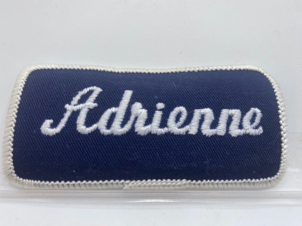 ADRIENNE  USED EMBROIDERED  SEW ON NAME PATCH TAG WHITE ON DARK BLUE