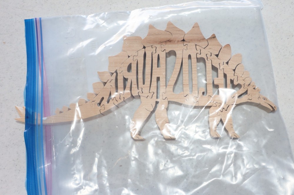 Wooden Stegosaurus Jigsaw Puzzle Dinosaur Spells Stegosaurus