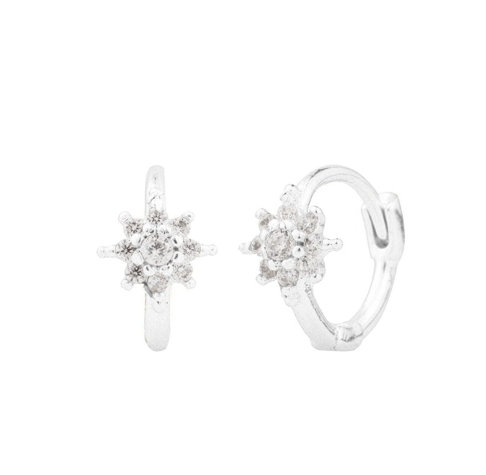 Tiny silver huggie hoop earrings with sunburst cartilage design  