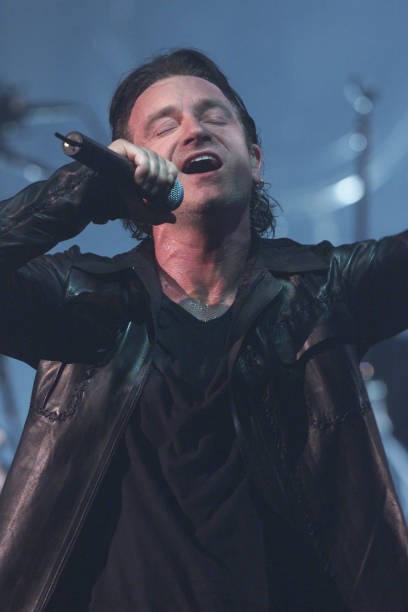 Bono and U2 play at the finale of the Brit Awards at Earls Court 2- Old Photo 1