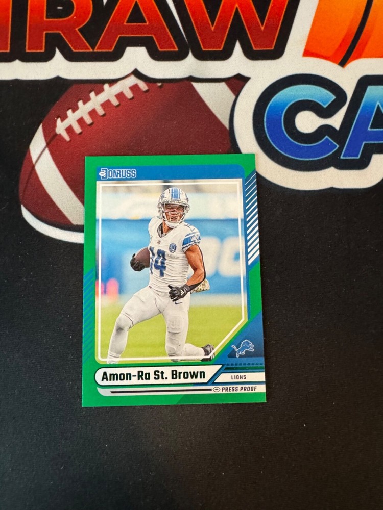 Amon-Ra St. Brown 2024 Donruss 139 Green Press Proof Detroit Lions