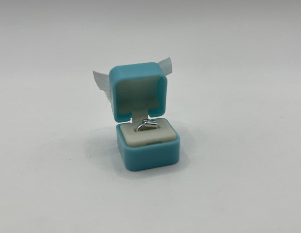 Mini Brands Ring With Blue Case