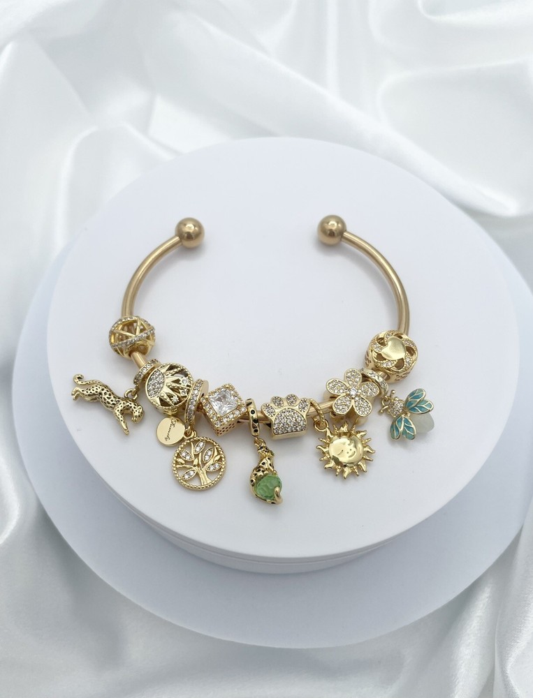 Linx Yellow Gold Open Bangle with Green and Gold Themed Charms