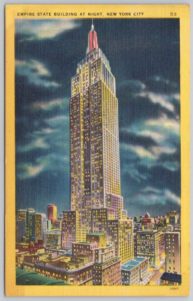 Discover NYC's Empire State Building illuminated at night on a linen postcard