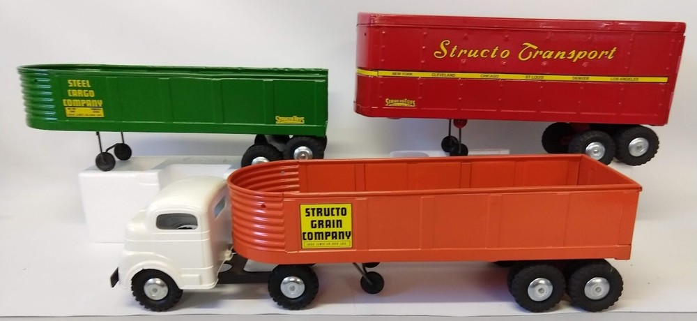 Structo Construction truck with three trailers. (Green has no rear gate)