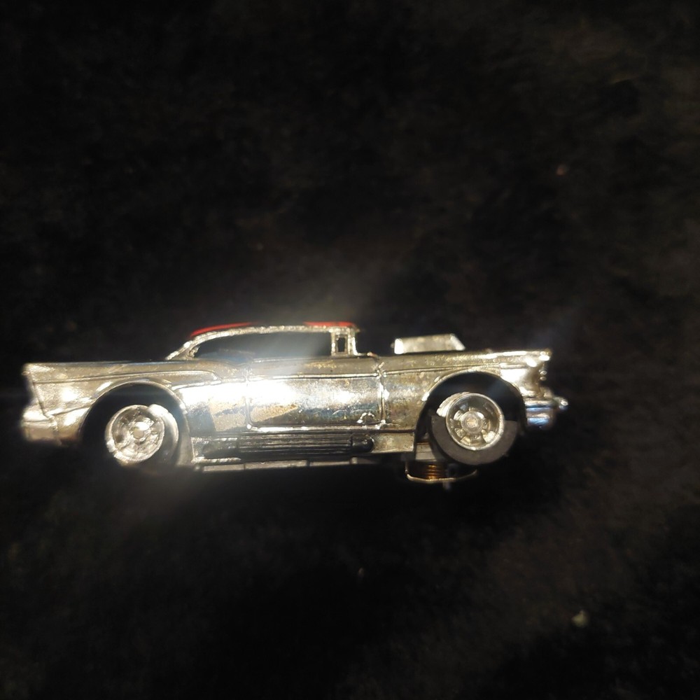 1957 Chevy Bel Air Curve Hugger Chassis in Chrome with Red & Blue Flames