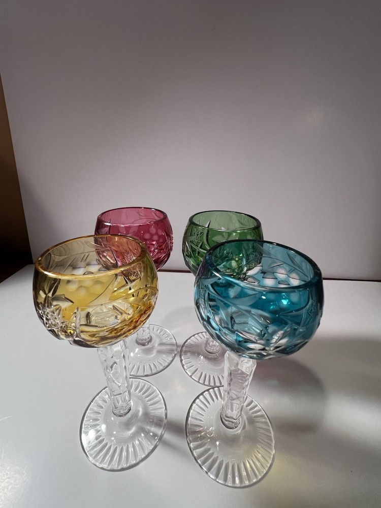 These are vintage Nachtmann Traube crystal cordial glasses featuring a colorful