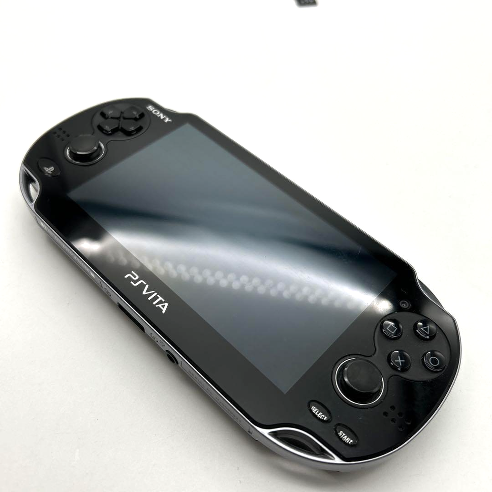 PlayStation PS Vita PCH-1000 Black in Top Mint Condition Includes Charger and 4GB Memory Card
