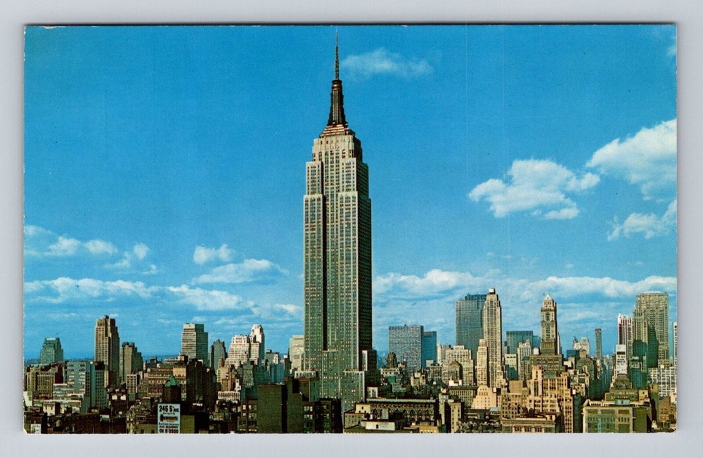 Discover the iconic Empire State Building in New York City with this antique vintage souvenir postcard from NY