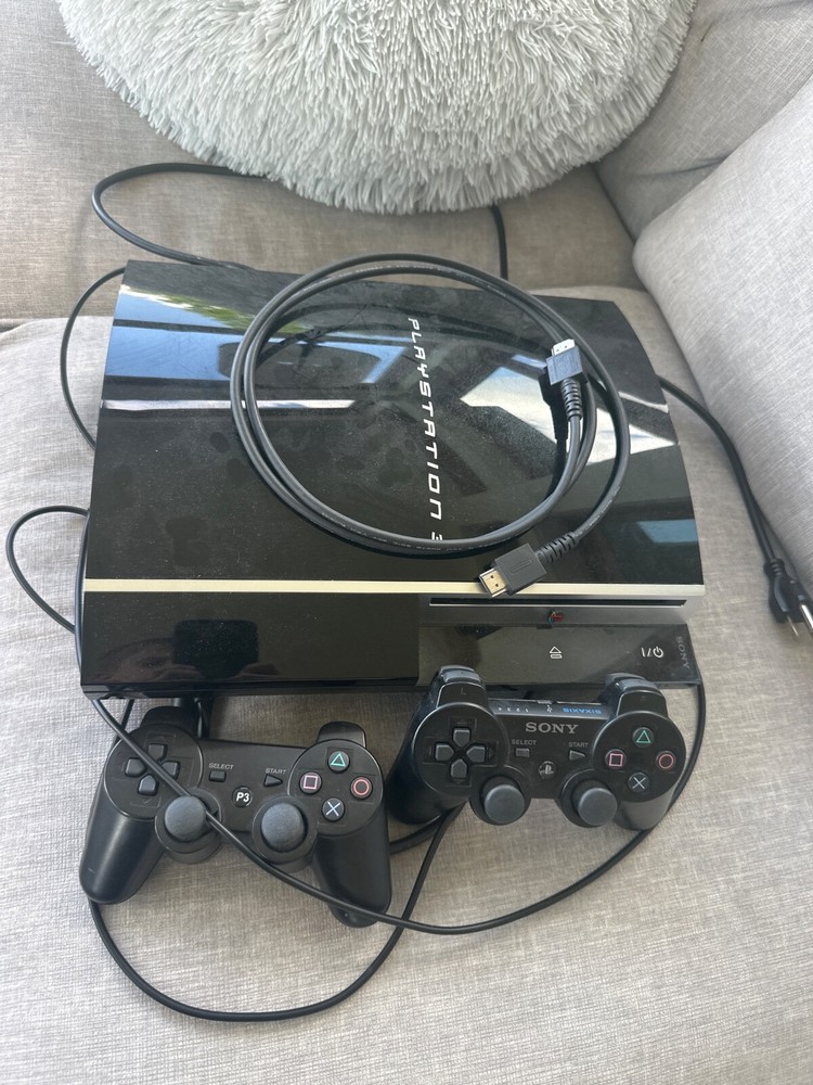 Sony PlayStation 3 8GB Console (Black) includes 10 games