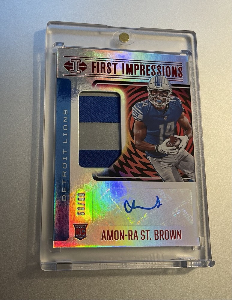 Amon-Ra St. Brown /99 — 2021 Panini Illusions First Impressions Auto (RC) (RPA)