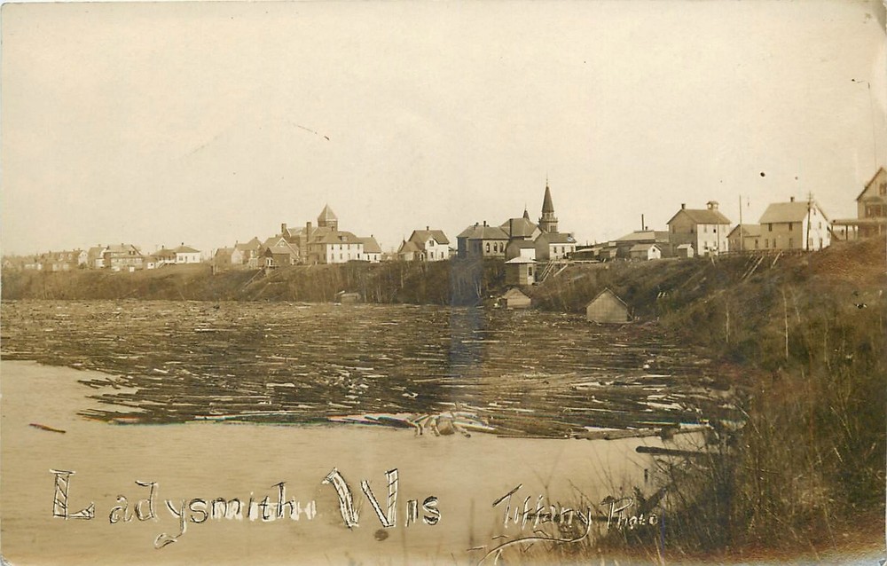 c1910 Ladysmith Wisconsin View of Town and Lumber RPPC Postcard 25-8105
