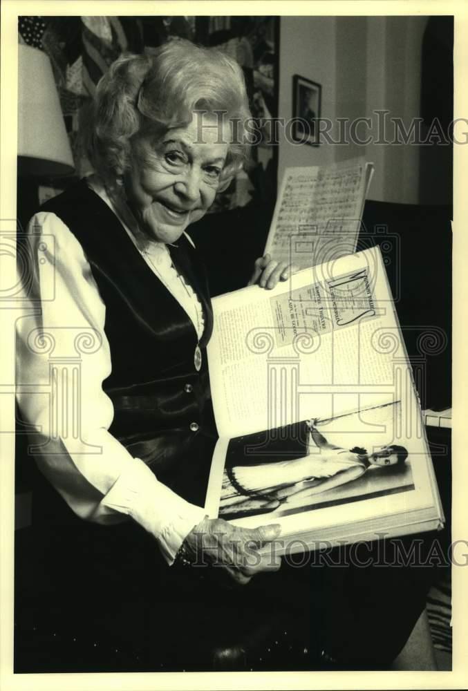 Elderly Woman Smiling at Her Younger Self in Scrapbook Photo - Sap52964