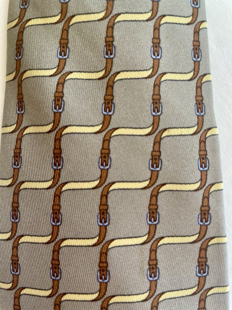 Hermès Paris men's necktie.  100% silk.  Brown & Yellow Equestrian Pattern.