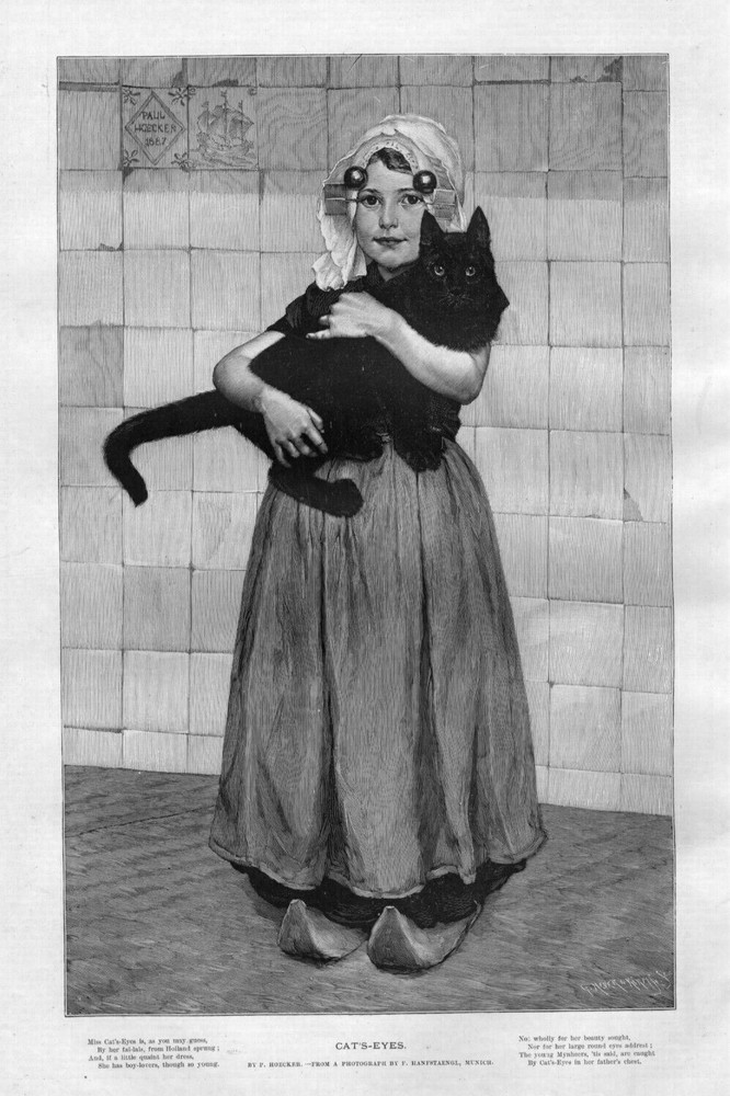 CAT'S EYES YOUNG DUTCH HOLLAND GIRL WEARING DRESS AND WOODEN SHOES HOLDING CAT