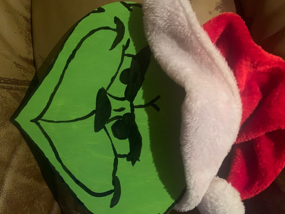 Festive wooden Grinch face holiday decor on sale for $5 post-Christmas-image