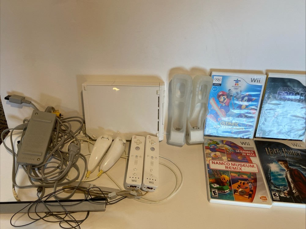 Nintendo Wii Console Bundle with 2 Controllers, Nunchucks, Motion Sensor, Manuals, and 4 Games