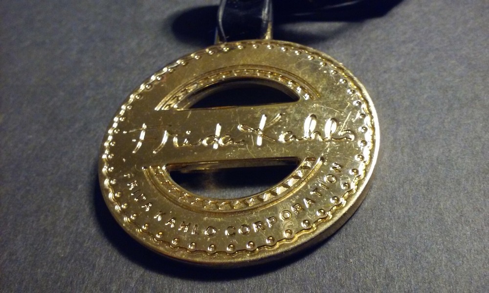 FRIEDA KAHLO CORPORATION Hang Fob Tag Tab Ornament Medallion for Handbag Purse