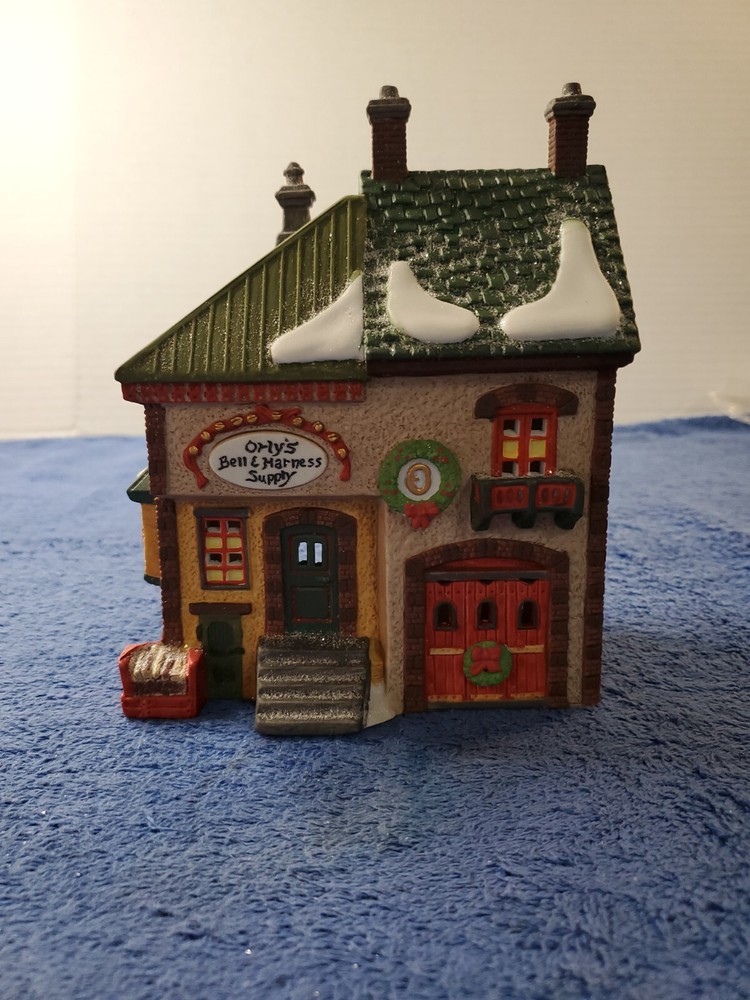 Department 56 North Pole Series Orlys Bell & Harness Supply 5621-9 Collectible Holiday Village Piece